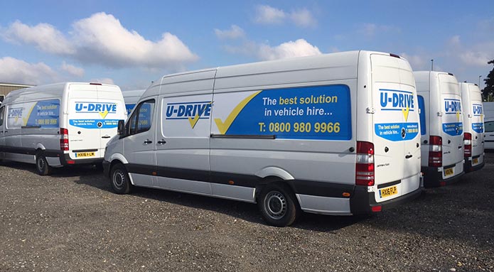 White van with U-Drive vehicle hire graphic sticker